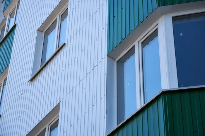 Vertical steel siding